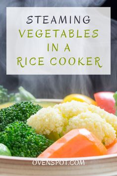 steaming vegetables in a rice cooker with broccoli, cauliflower and carrots