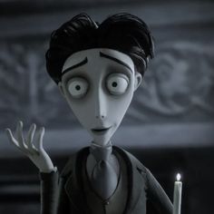 an animated character holding a lit candle in front of his face and wearing a suit