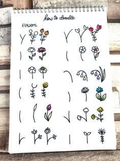 a notebook with flowers drawn on it