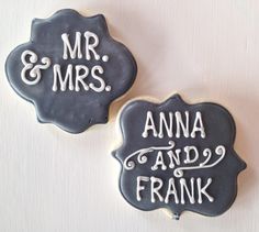 two decorated cookies with the words mr and mrs on them