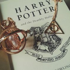 a harry potter book with a necklace on it