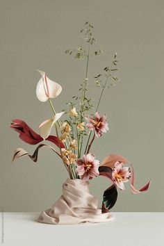 a vase filled with flowers on top of a table