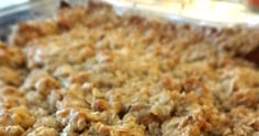 a casserole dish filled with oatmeal and meat