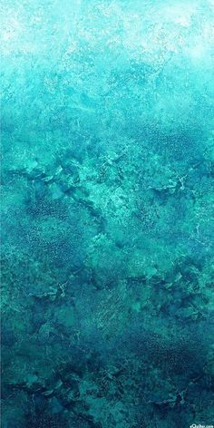 the water is very blue and green with little bubbles on it's surface, as well as some other things