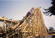 a roller coaster with people riding on it