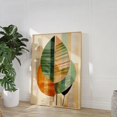 a painting on the wall next to a potted plant in a room with white walls