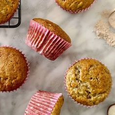 several muffins sitting on top of a marble counter