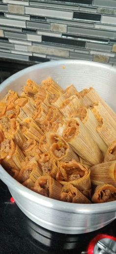 a pan filled with food sitting on top of a stove