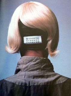 the back of a woman's head with a label on it