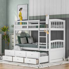 a white bunk bed with drawers underneath it