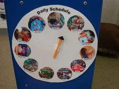 a blue and white clock with pictures on it