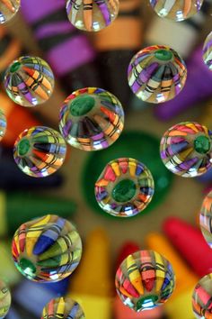 many colorful bubbles floating in the air on top of each other with different colors and shapes