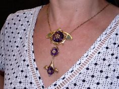 Jewelry Type: Plique A Jour Necklace ( Excllent Condition) Metal: 14k Yellow Gold Measurements: 3 3/4 inches x 2 inches (center section) 20 inch (length of chain) Markings: None Weight: 41.7 grams Main Stone: 3 Round Amethyst Color: Purple Measurement: A) 22mm x 11mm 20cts approx B) 12mm x 7mm 3cts approx C) 12mm x 7mm 3cts approx Gem Weight: 26ct approx Accent Stones: 6 matching Round Rose Cut Diamonds Color: I Clarity: SI-1 Gem Weight: 0.06ct approx. #12383 Art Deco Amethyst Jewelry In Yellow Gold, Art Deco Amethyst Yellow Gold Jewelry, Purple Art Deco Necklace For Gift, Art Nouveau Purple Jewelry For Gift, Purple Art Nouveau Jewelry For Gift, Purple Art Nouveau Jewelry Gift, Formal Art Nouveau Amethyst Jewelry, Plique A Jour, Petite Ring