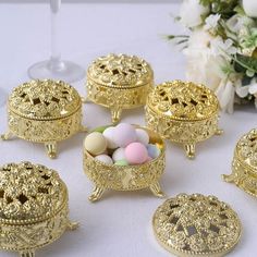 there are many small gold objects on the table