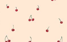 cherries on a pink background with green stems