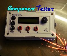 an electronic device with the words component tester on it's screen and sparks coming out