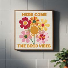 there is a cross - stitch pattern on the wall with words here come the good vibes