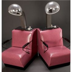 two pink chairs sitting next to each other