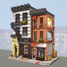 a large building made out of legos on top of a blocky platform with windows and balconies