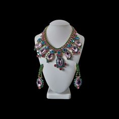 "Multicolor vintage rhinestone necklace sets - Absolue. Add a touch of retro elegance to your look with this stunning jewelry set.   Add a touch of retro elegance to your look with this stunning Multicolor Vintage Rhinestone Necklace and Earring Jewelry set. The set features a designer necklace and matching earrings that exude charm and sophistication. The vibrant and sparkling rhinestones in various colors create a captivating and eye-catching effect. Elevate your style and make a fashion statement with this unique jewelry set. Perfect for women who appreciate the timeless beauty of vintage-inspired accessories, this necklace set is sure to add a touch of glamour to any outfit. --- Roman Matous, a prominent Czech designer, specializes in crafting luxury jewelry and exquisite pieces made w Glamorous Multicolor Wedding Jewelry, Costume Jewelry Crystal Jeweled Sets, Jeweled Crystal Jewelry Sets In Costume Style, Jeweled Crystal Costume Jewelry Set, Crystal Jeweled Costume Jewelry Sets, Multicolor Crystal Jewelry For Evening, Elegant Multicolor Rhinestone Necklace With Bling, Elegant Multicolor Crystal Embellished Jewelry, Vintage Rhinestone Necklace