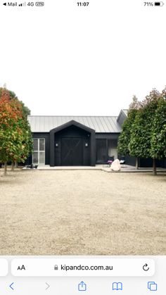 an iphone photo of a house with trees in the background