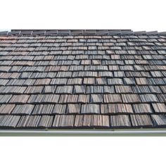 the roof of a building with wooden shingles