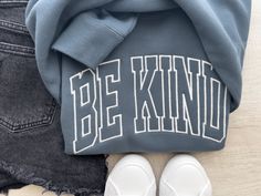 Feeling the world needs a little extra dose of kindness? You're not wrong! Share the love (and maybe some cozy comfy vibes) with this super cozy sweatshirt embroidered with a warm and fuzzy "BE KIND" message. It's a gentle reminder to ourselves and a sweet message to the world, all wrapped up in pure comfort. Perfect for spreading kindness wherever you go, or simply cuddling up with a warm drink and a kind heart. Features: Popular Comfort Colors® Brand ☁️ Soft and cozy fleece sweatshirt material Trendy Letter Embroidery Sweatshirt For Loungewear, Trendy Oversized Sweatshirt With Embroidered Text, Everyday Winter Sweatshirt With Embroidered Text, Comfy Vibes, Spreading Kindness, Sweet Message, Sweet Messages, Embroidered Sweatshirt, Fleece Sweatshirt