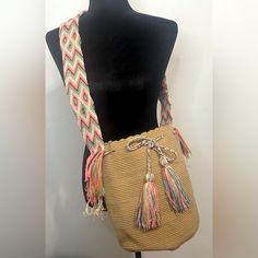 This One-Of-A-Kind Large Crossbody Wayuu Bag Took Approximately 10-15 Days To Crochet. This Wayuu Bag Was Created For The Woman That Values And Appreciates True Craftsmanship. Convenient, Easy To Pack And Easy-To-Wash, It’s A Wearable Work Of Art! See Here For Care Instructions As The Bags Are Made Of Acrylic, Dirt Rubs Off Quite Easily! I Always Recommend To Hand Wash And Lay Flat To Dry As Some Drawstrings And Tassels May Get Damaged In The Washing Machine. Specs & Sizing Material: 100% Acryli Multicolor Satchel With Adjustable Strap For Beach, Beach Multicolor Satchel With Adjustable Strap, Everyday Multicolor Bag With Long Strap, Everyday Multicolor Bags With Long Strap, Casual Handmade Adjustable Shoulder Bag, Casual Adjustable Handmade Shoulder Bag, Multicolor Beach Satchel With Adjustable Strap, Bohemian Bag With Long Strap For Daily Use, Bohemian Bags With Long Strap For Daily Use