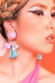 These bubbly earrings in pink and blue are so pretty, it's true. With bubblegum ball studs, and purple rhinestone candy orbs, these earrings are good enough to eat. Wear it on your birthday, or just about any holiday. You'll look oh-so-yummy everyday. The Birthday Cake tassel earrings are part of our Retro Candy Shop Collection inspired by the retro era of colorful fashion. Rewind to the nostalgic days with our eye-candy earrings in different flavors to wear with your bold print dress. A little bit of retro to your style makes the world sweeter and a little more vibrant. Playful Jewelry With Matching Earrings For Party, Glamorous Pink Earrings For Celebration, Playful Pink Earrings For Party, Playful Purple Jewelry For Party, Playful Purple Party Jewelry, Playful Pink Jewelry For Party, Playful Pink Party Jewelry, Playful Pink Beaded Earrings, Party Jewelry With Pink Dangling Beads