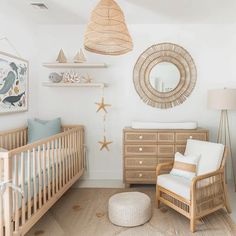 a baby's room with a crib, dresser and mirror