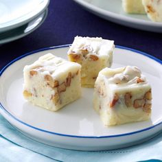 three pieces of cake sitting on top of a white plate