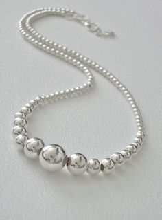 "Sterling Silver Graduated Bead Necklace Elegant 16 - 18\" adjustable tarnish resistant sterling silver hollow graduated bead (3-10mm) necklace; an all-around necklace for almost any occasion." Luxury Silver Rondelle Beaded Necklaces, Luxury Sterling Silver Beaded Chain Necklace, Luxury Traditional Silver Beaded Necklaces, Beaded Jewelry Necklaces, Necklace Elegant, Silver Bead Necklace, Dangle Necklaces, I Love Jewelry, Silver Bead