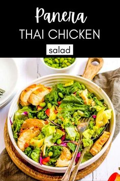 a bowl filled with salad and topped with chicken