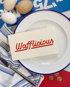 a wafflehouse sign on a plate next to eggs and utensils