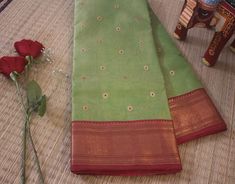 Here we have a Green Pure Chanderi Handloom Tissue Silk Saree with all over fine zari booties. Moreover the fabric is pure Chanderi tissue silk with a very beautiful border. Chanderi Sarees are very light weight and have a fabulous lustre. You can easily distinguish a Chanderi by its sheer texture. Moreover, either it be a day or night function, this Saree can be worn any time. Surely, chanderis are a favourite among women of all age groups. Additional Information Color : Green Technique: Kadhuw Gold Cotton Silk Dupatta With Embroidered Border, Cotton Silk Traditional Wear With Embroidered Border For Puja, Traditional Cotton Silk Wear With Embroidered Border For Puja, Festive Tissue Silk Traditional Wear With Border, Traditional Wear With Tissue Silk Border, Festival Tissue Silk Traditional Wear With Border, Festival Traditional Tissue Silk Wear With Border, Traditional Pista Green Dupatta With Border, Festive Cotton Silk Traditional Wear With Border