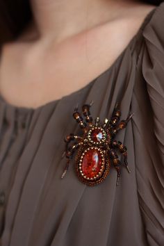 "Spider brooch it is embroidered brooch by bead and gimp. This woodlander jewelry is best Halloween gift. Spider jewelry has a has a size approximately 3.2*2.7 inches (8*7 cm). Beaded spider brooch, designer's jewelry inspired by Nature - insect brooch Spider with imitation of amber, Czech crystal beads. It will perfectly complement your unique jewelry collection or will be a wonderful gift as a Halloween brooch. Looks very elegant! A Spider jewelry brooch is carefully bead embroidered on leathe Handmade Brooches For Halloween Gift, Halloween Brooch Jewelry Gift, Halloween Gift Jewelry Brooch, Halloween Brooch, Spider Brooch, Insect Brooch, Spider Jewelry, Beaded Spiders, Embroidered Brooch