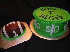 two cakes made to look like footballs with green frosting and white letters on them