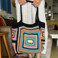 This colorful and stylish crochet boho bag is the perfect accessory for any fashion-forward individual who loves unique and handmade items. It's versatile and functional, serving as both a shoulder bag and a tote bag to accommodate all your belongings.  This colorful bag features intricate granny square patterns, carefully crocheted by hand using high-quality materials. Make a bold statement with this one-of-a-kind crochet handbag, and show off your love for bohemian-inspired fashion. Measuremen Handbags Crochet, Crochet Boho Bag, Colorful Handbags, Stylish Crochet, Crochet Handbag, Crochet Boho, Crochet Tote Bag, Colorful Bags, Granny Squares Pattern