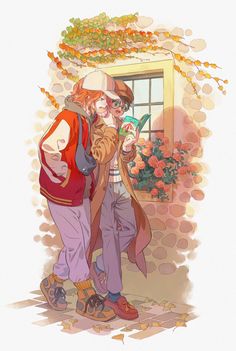 two people standing next to each other with flowers in front of them and one person holding a cat