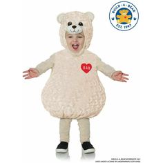 a young child in a teddy bear costume