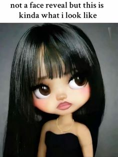 a doll with long black hair and big eyes