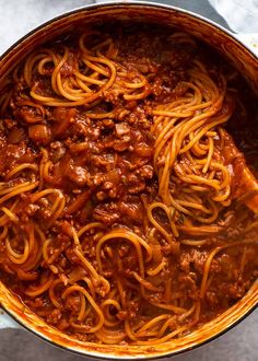 a large pot filled with spaghetti and meat