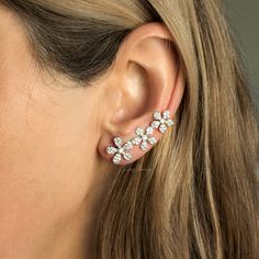 "You will feel like a goddess with this flowers ear climber earrings. Clear cubic zircons are used in this pave crawler ear cuff and crafted in solid sterling silver.  Only requires one standard ear piercing to put this glamorous earrings on simply place it through your pierced hole like ordinary earrings and then flip it to the side and slide it over your ear like a bobby pin. They gently climb up your ear giving you a trendy and delicate look! Approximate size 1,3\" - 33mm ⭐ Sterling Silver Option >> Made of solid 925 Sterling Silver ⭐ Rose Gold Filled Option >> Rose Gold filled over solid 925 Sterling Silver ⭐ The price is for a pair earrings. To see other stone variations of this earrings ⭐ https://etsy.me/3jcpMQP To see more climber earrings:  ⭐ https://etsy.me/3uZvCZv For more simila Silver Cubic Zirconia Ear Climbers For Wedding, Cubic Zirconia Ear Climbers For Wedding, Ear Climber Earrings Silver, Glamorous Earrings, Bracelets Stacked, Ear Climber Earrings, Gold Bracelets Stacked, Jewelry Chunky, Ear Climbers Earrings