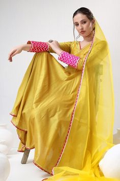 Yellow cotton silk anarkali featuring gota lace embroidery and a V-neckline. Paired with a matching pant and an organza dupatta adorned with intricate lace trim., Fit: Relaxed Lace Anarkali, Yellow Anarkali, Silk Anarkali, Trim Fit, Organza Dupatta, Women Kurta, Lace Embroidery, Embroidered Silk, Set For Women