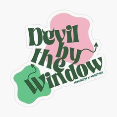 the devil in the window sticker is green and pink, with an arrow pointing to it