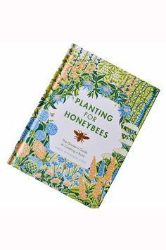 a book with the title planning for honeybees written in green, blue and yellow