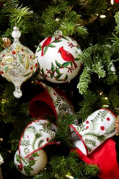 a christmas tree with ornaments hanging from it's branches