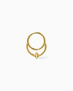 two gold rings with an arrow on the middle and one in the middle, against a white background