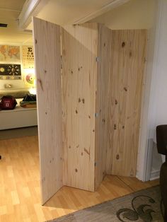 the room dividers are made out of plywood planks and have been installed