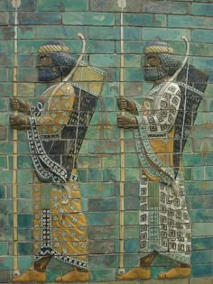 two ancient egyptian men are depicted on a wall